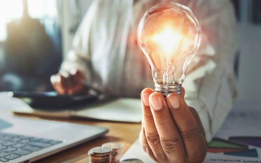 businessman hand holding light bulb. idea concept with innovation and inspiration